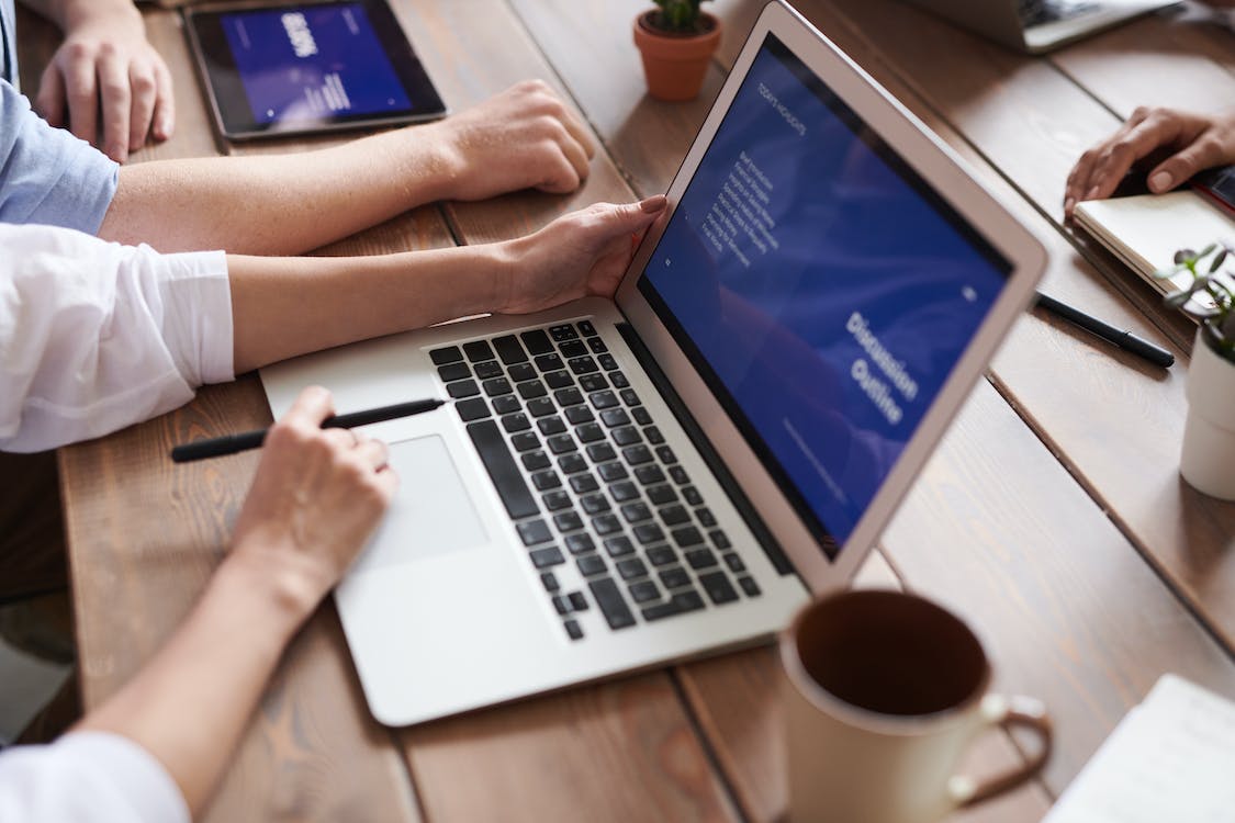 Free Photo Of Person Holding Laptop Stock Photo