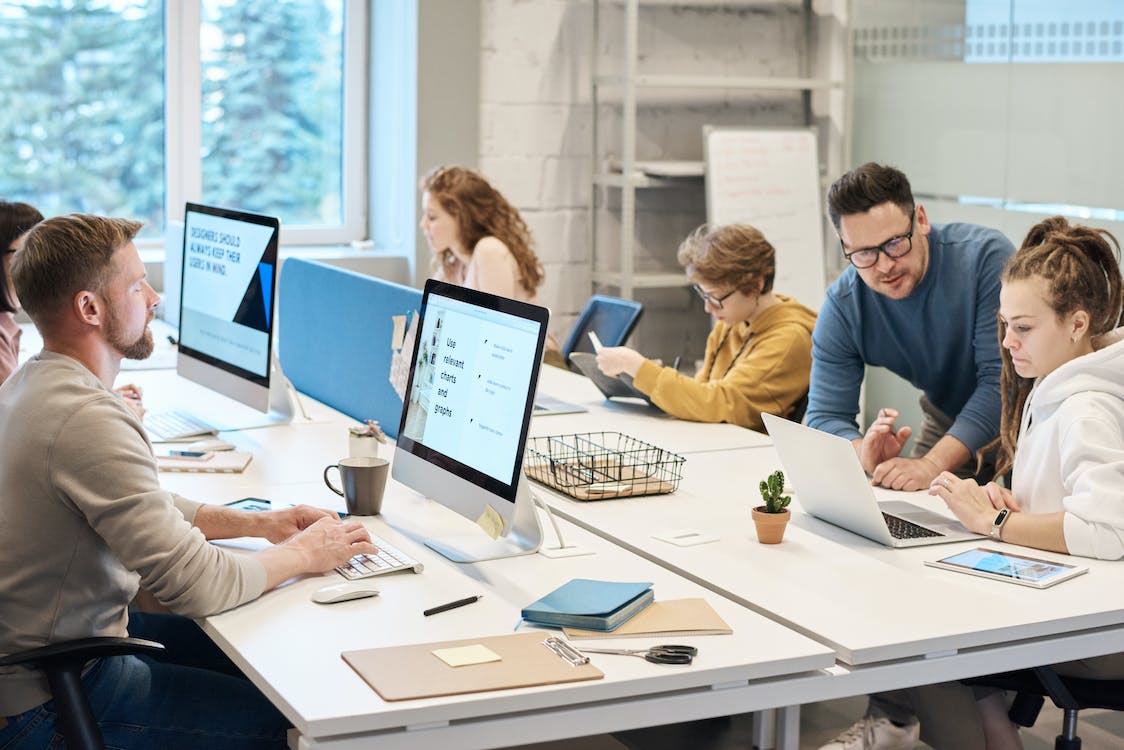 Free People Working in front of the Computer Stock Photo