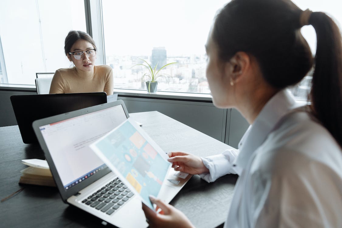 Free Women Having a Meeting at the Office Stock Photo